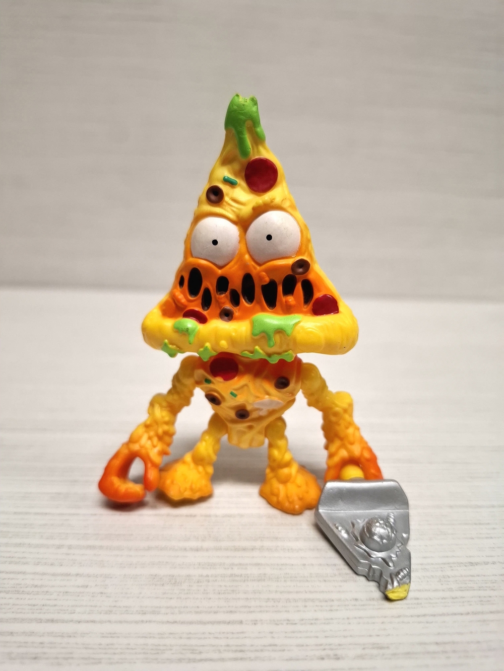 Yellow Pizza Monster Action Figure with Silver Slice Accessory